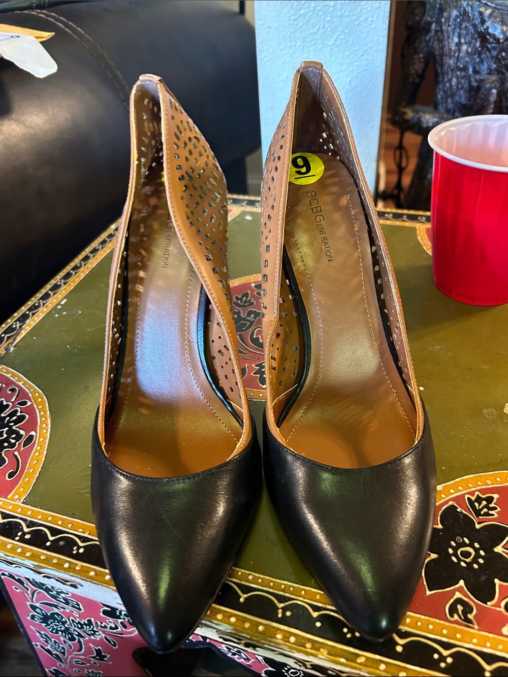 BCBGeneration Black and Tan Laser-Cut Pointed-Toe Pumps - Picture 3 of 5